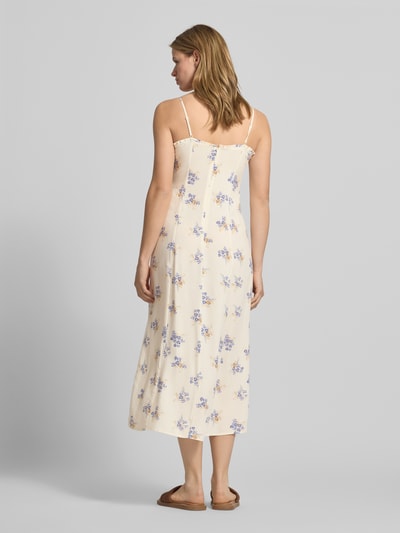 Frauenmodel trägt Schmales Freizeitkleid aus reiner Viskose Modell 'NELLY' von Only mit Allover-Muster, schmale Passform, Midi-Länge, Henley-Ausschnitt, Animal-Print, Reißverschluss, Spaghettiträgern, Popeline-Struktur in Creme mit lila und gelben Akzenten, Material: reine Viskose, Ganzkörperansicht Rückansicht.