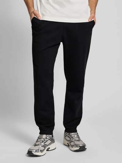 CHAMPION Spodnie dresowe z elastycznym ściągaczem Czarny 4