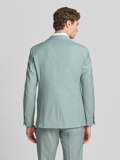 Männermodel trägt mintgrünes Slim-Fit 2-Knopf-Sakko mit Pattentaschen Modell 'Monopoly' von CINQUE, Material-Mix mit Schafswoll-Anteil, Ganzkörperansicht Rückansicht.
