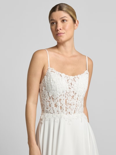 Vrouwenmodel draagt Brautkleid inklusive Stola mit Spitze van Mascara, semi-transparant met bloemenkant, getailleerd, mouwloos design met spaghettibandjes, Maxilengte, onderrok, ruglengte maat 36: 128 cm, borstwijdte maat 36: 41 cm, frontale close-up van het bovenlichaam.