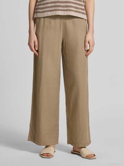 Frauenmodel trägt Wide-Leg-Pants aus Leinen-Viskose-Mix mit Elastikbund und Eingrifftaschen, Modell 'LINNO' von ICHI, Nahaufnahme Oberkörper.