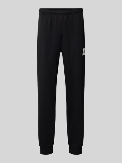 Produktfoto, Regular Fit Sweatpants aus Escorial-Mix von The North Face, czarne, wpuszczane kieszenie, tunel, nadruk z logo, mieszanka wełny escorial, długość wewnętrzna nogawki 75 cm, rozmiar M