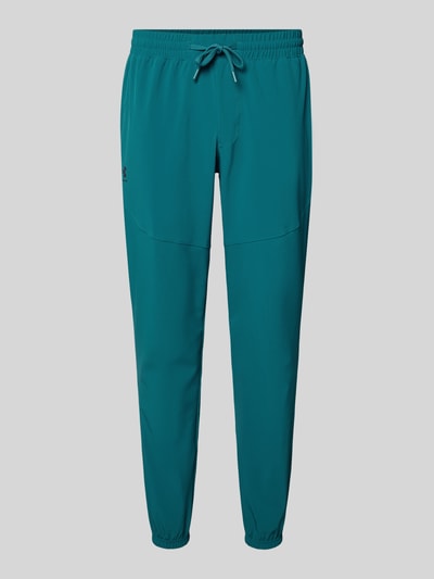 Produktfoto, Regular Fit Jogger mit Logo-Print Modell 'Vibe' von Under Armour aus Elastischer-Material-Mix in Türkis, Elastikbund mit Tunnelzug, Eingrifftaschen, Beinabschlüsse, Herren, Innenbeinlänge 78 cm bei Größe M