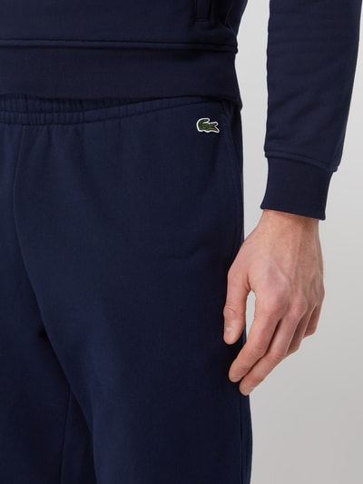 Lacoste Spodnie dresowe o kroju tapered fit z logo Granatowy 3