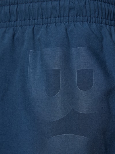 Produktfoto, Badeshorts mit Label-Schriftzug Modell 'ORCA' von BOSS, Optik: Unifarben, glatte Textur, dunkles Blau, Detailaufnahme