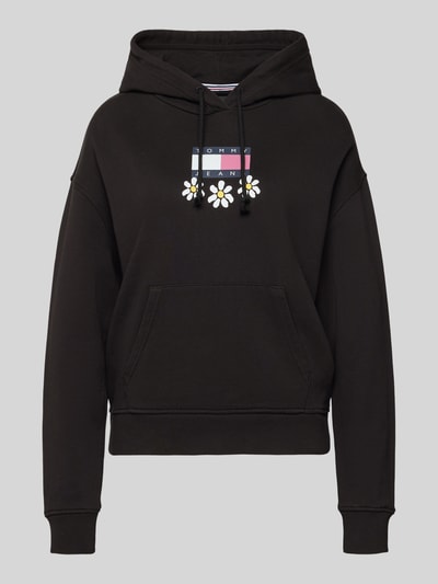 Produktfoto, czarny Hoodie z nadrukiem label i motywem kwiatów, model 'DAISY FLAG' od Tommy Jeans, damski, luźny krój, bawełniany mix.