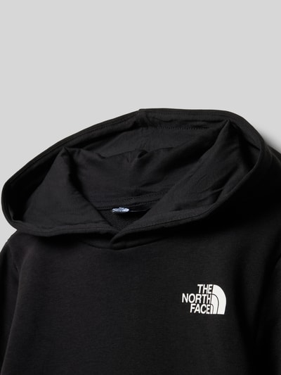 Produktfoto, schwarzer Regular Fit Hoodie mit Logo-Print von The North Face, Baumwoll-Mix, Känguru-Tasche, elastische Abschlüsse, glatte Textur