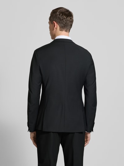 Männermodel trägt schwarzes Regular Fit Sakko mit Woll-Anteil Modell 'Irving' von Drykorn, Rückenansicht, glatte Struktur.