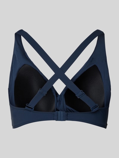 Frauenmodel trägt Bikini-Oberteil mit Knotendetail Modell 'SOLID' von Barts aus dunklem Material-Mix mit Stretch-Anteil, körpernahe Passform, Rückansicht.