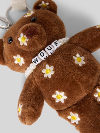 Produktfoto, Schlüsselanhänger mit Logo-Detail Modell 'Choco Bear' von WOUF, brauner Plüsch, weiße Blüten, Schlüsselring, Karabinerhaken, Damen.