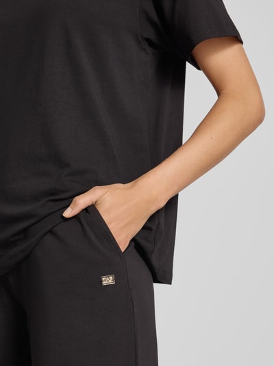 EA7 Emporio Armani Sweatpants met wijde pijpen en labeldetail Zwart - 3