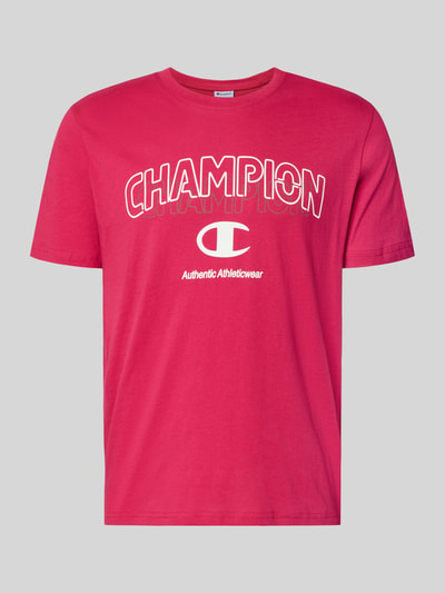 Produktfoto, T-Shirt mit Label-Print und Rundhalsausschnitt von CHAMPION in Rot, reine Baumwolle, Regular Fit, dezenter Print, glatte Struktur.