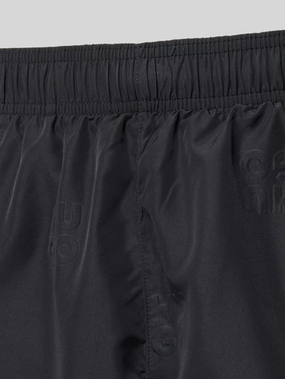 Produktfoto, Badehose mit Allover-Muster Modell 'TONAL_LOGO' von HUGO in Schwarz mit matter und leicht glänzender Textur, Herren Badehose