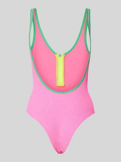 Produktfoto, Badeanzug mit Stretch-Anteil Modell 'SMAK POPMIX' von Banana Moon, strukturierte pinke Oberfläche, gelber Reißverschluss, grüner Rand, Colour-Blocking-Design