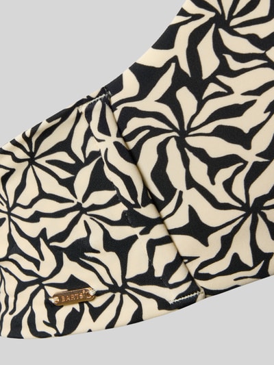 Produktfoto, Bikini-Oberteil mit Ring-Detail Modell 'Mahry' von Barts aus Material-Mix mit Stretch-Anteil, schwarzes Muster auf cremefarbenem Grund, Label-Detail.