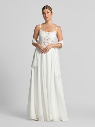 Vrouwenmodel draagt Brautkleid inklusive Stola mit Spitze van Mascara, getailleerd, semi-transparante look, florale kant, Maxilengte, stola, vetersluiting aan de achterkant, mouwloos design met spaghettibandjes, onderrok, ruglengte maat 36: 128 cm, borstwijdte maat 36: 41 cm, Ganzkörperansicht van voren.