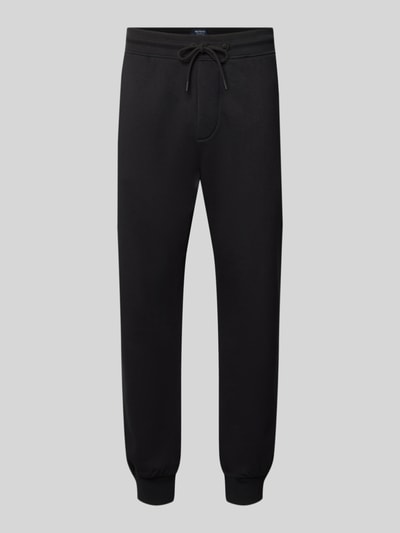 Produktfoto, Straight Fit Jogginghose aus Baumwoll-Mix von MCNEAL in Schwarz mit elastischen Abschlüssen und Eingrifftaschen auf grauem Hintergrund.