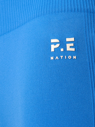 Produktfoto, High Rise Leggings mit Logo von P.E Nation in kräftigem Blau, strukturierter Material-Mix mit elastischem Bund und Logo-Detail.