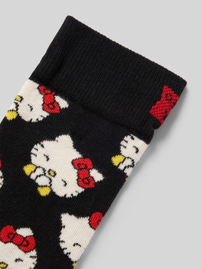Produktfoto, Socken aus Baumwoll-Mix Modell 'HELLO KITTY LAUGHING' von Happy Socks in Schwarz mit weißem, gelbem und rotem Muster, elastisches Rippenbündchen, Label-Detail, Damen Socken