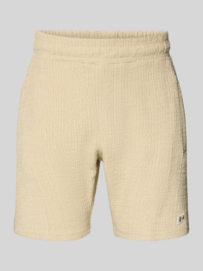 Produktfoto, Shorts mit Label-Patch Modell 'LIBCO' von Pegador, kremowy kolor, prosty krój, strukturalna faktura, bawełniany materiał, elastyczny pas, szerokość w rozmiarze M 38 cm, długość nogawki wewnętrznej 23 cm