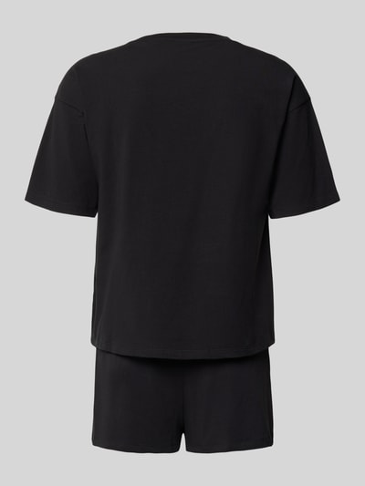 Männermodel trägt Regular Fit Pyjama-Set aus Baumwoll-Mix Modell 'NITE' von HUGO, efekt: jednolity kolor, krój regular fit, aplikacja: naszywka z logo, dekolt: okrągły dekolt, rękaw: krótki rękaw, ściągacz: elastyczny, komplet, wykończenie materiału: dżersej, materiał: mieszanka bawełny, Ganzkörperansicht Rückansicht