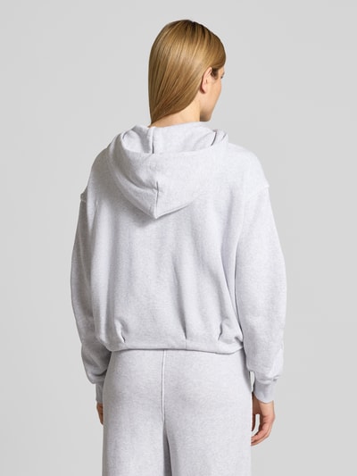 Frauenmodel trägt Regular Fit Sweatjacke aus Baumwoll-Mix Modell 'C_ELENDY' von BOSS Orange, Optik: Unifarben, Ganzkörperansicht Rückansicht.