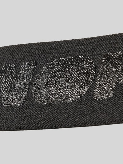Produktfoto, schwarzer elastischer Material-Mix mit glänzendem Label-Detail, Harness mit Cut Outs Modell 'Night Universe' von WOH