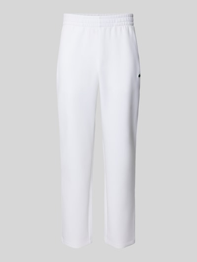 Produktfoto, Tapered Sweatpants mit Baumwoll-Anteil von Lacoste Sport in Weiß, unifarbene Optik, elastischer Bund, seitliche Reißverschlusstaschen, glatte Scuba-Textur, Logo-Patch