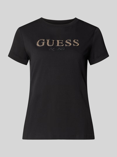 Produktfoto, Regular Fit T-Shirt aus reiner Baumwolle mit Logo-Applikation von GUESS, schwarzer Stoff, goldene Schrift, Rundhalsausschnitt, kurzärmelig, Damen T-Shirt, Rückenlänge bei Größe S 52 cm