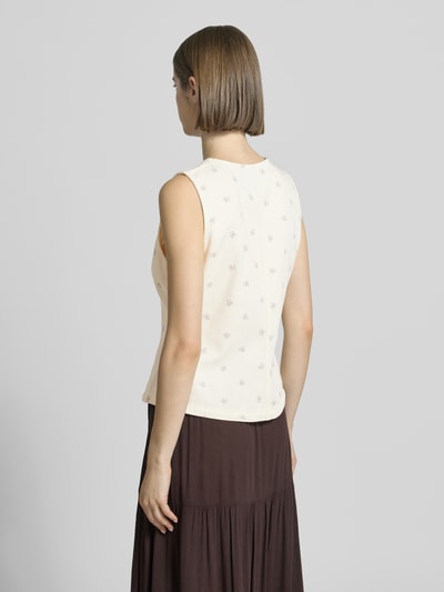 Frauenmodel trägt Regular Fit Weste aus reiner Baumwolle Modell 'NAOMI' von Only mit florales-Allover-Muster, Materialverarbeitung: Twill, Ganzkörperansicht Rückansicht.