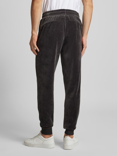 PUMA PERFORMANCE Relaxed Fit Sweatpants mit Label-Stitching Modell 'Velvettrack' Black 5