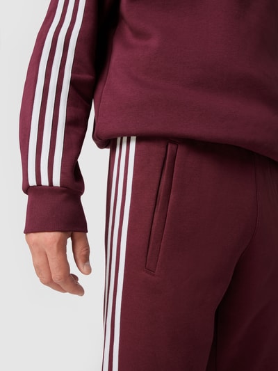 adidas Originals Sweatpants mit Logo-Streifen Pflaume 3