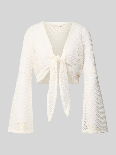 Produktfoto, Strickjacke mit Knotendetail und Trompetenärmeln von Apricot in Cropped-Schnitt, Semitransparent, cremefarben, strukturierte Oberfläche.