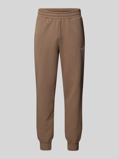 PUMA PERFORMANCE Sweatpants mit Logo-Stitching Taupe 1