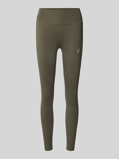 Produktfoto, Leggings mit Stretch-Anteil Modell 'CORE' von ASICS TIGER in Olivgrün, elastyczna mieszanka materiałów, krój skinny fit, elastyczny pas, nadruk z logo
