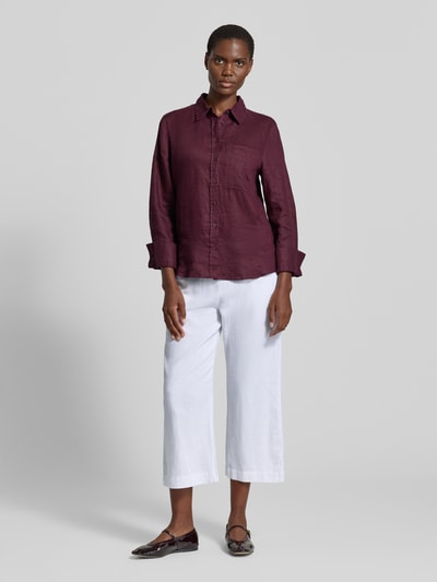 Frauenmodel trägt Wide-Leg-Pants mit elastischem Bund Modell 'Lava' von FREE/QUENT aus Leinen-Mix mit Viskose-Mix im Loose-Fit, weiß, mit seitlichen Eingrifftaschen, Kordelzug, glatte Textur, Ganzkörperansicht von vorne.