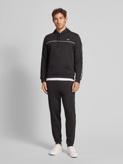 Lacoste Loose fit sweatpants van puur katoen, model 'TAPE' Zwart - 1