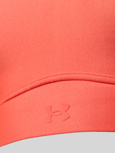 Produktfoto, Regular Fit Sport-BH mit Logo-Print Modell 'Infinity' von Under Armour, elastyczna mieszanka materiałów, krój regular fit, nadruk z logo, regulowane ramiączka, kolor jasnokoralowy, gładka faktura