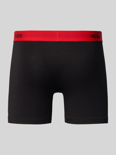 Produktfoto, Trunks mit elastischem Label-Bund im 3er-Pack Modell 'BOXER BRIEF' von HUGO in Optik: Unifarben, Materialverarbeitung: Jersey aus Baumwoll-Mix, Multipack: 3er-Pack, Farbkombination aus Schwarz und Rot, glatte Oberfläche