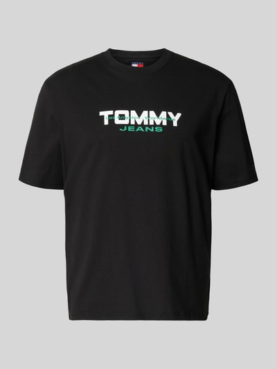 Produktfoto, Regular Fit T-Shirt aus reiner Baumwolle von Tommy Jeans, Optik: Unifarben schwarz, Label-Schriftzug, Rundhals, Kurzarm, Ärmelabschluss gerade, Materialverarbeitung: Webware, Material: reine Baumwolle.