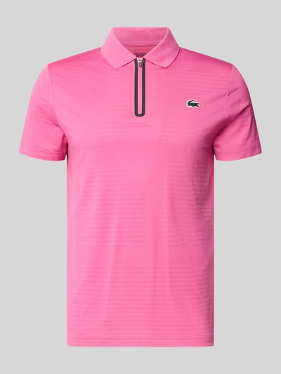 Produktfoto, Slim Fit Poloshirt aus schnelltrocknendem Material von Lacoste Sport, różowy, krój slim fit, jednolity, logo, krótki zamek, lekka tekstura