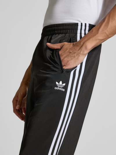 adidas Originals Spodnie treningowe z kieszeniami zapinanymi na zamek błyskawiczny model ‘FIREBIRD’ Czarny 3