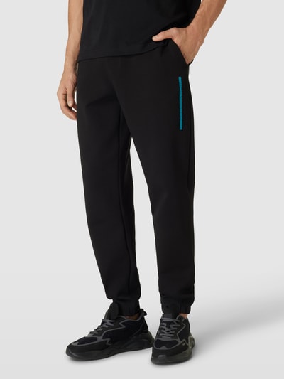 CK Calvin Klein Spodnie dresowe o kroju comfort fit w jednolitym kolorze Czarny 4