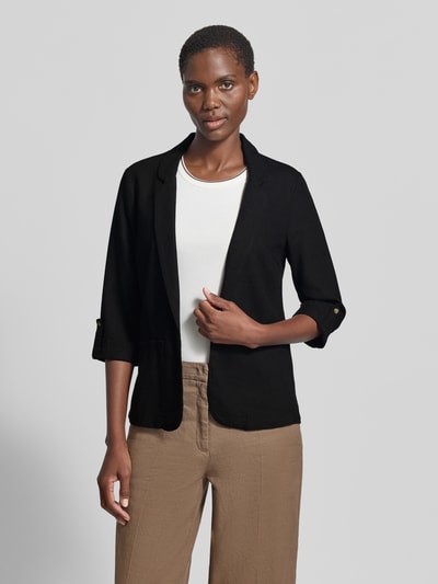 Frauenmodel trägt schwarzen Loose Fit Kurzblazer aus Viskose-Leinen-Mix Modell 'JESMILO' von Vero Moda, unifarben, Nahaufnahme Oberkörper.