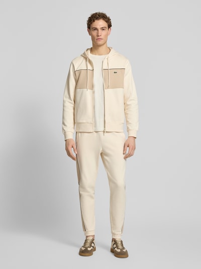 Lacoste Spodnie dresowe z czystej bawełny w kroju regular fit Złamany biały 1