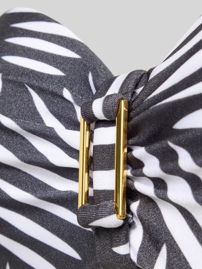 Produktfoto, PLUS SIZE Bikini-Oberteil mit Bügel Modell 'Liv' von LASCANA, schwarz-weißes Zebramuster, goldene Metallschnalle, Material-Mix mit Stretch-Anteil, Bandeau Fit, vorgeformte Cups, Detailaufnahme.