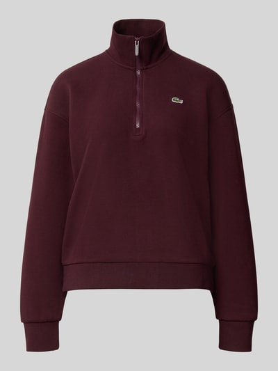 Produktfoto, Relaxed Fit Sweatshirt aus Baumwoll-Mix von Lacoste in dunklem Bordeauxrot mit Logo, glatte Textur vor grauem Hintergrund. Damen Sweatshirt von Lacoste
