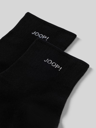 Produktfoto, schwarze Socken mit Strasssteinbesatz von JOOP!, Baumwoll-Mix mit Modal-Anteil, Logo-Detail, elastischer Bund, glatte Textur