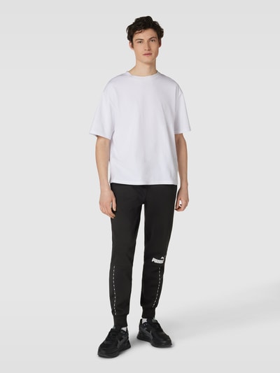 PUMA PERFORMANCE Sweatpants mit Label-Print Modell 'ESS BLOCK x TAPE' Black 1