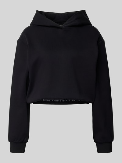 Productfoto, Cropped Hoodie aus reiner Baumwolle van Anine Bing, zwart, losse pasvorm, capuchon, elastische logo-band, lengte 55 cm bij maat S